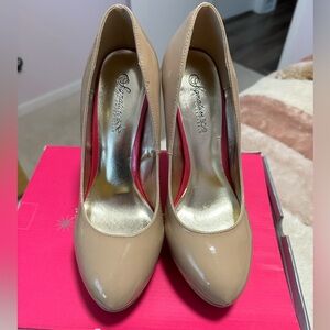 Nude heels with pink sole